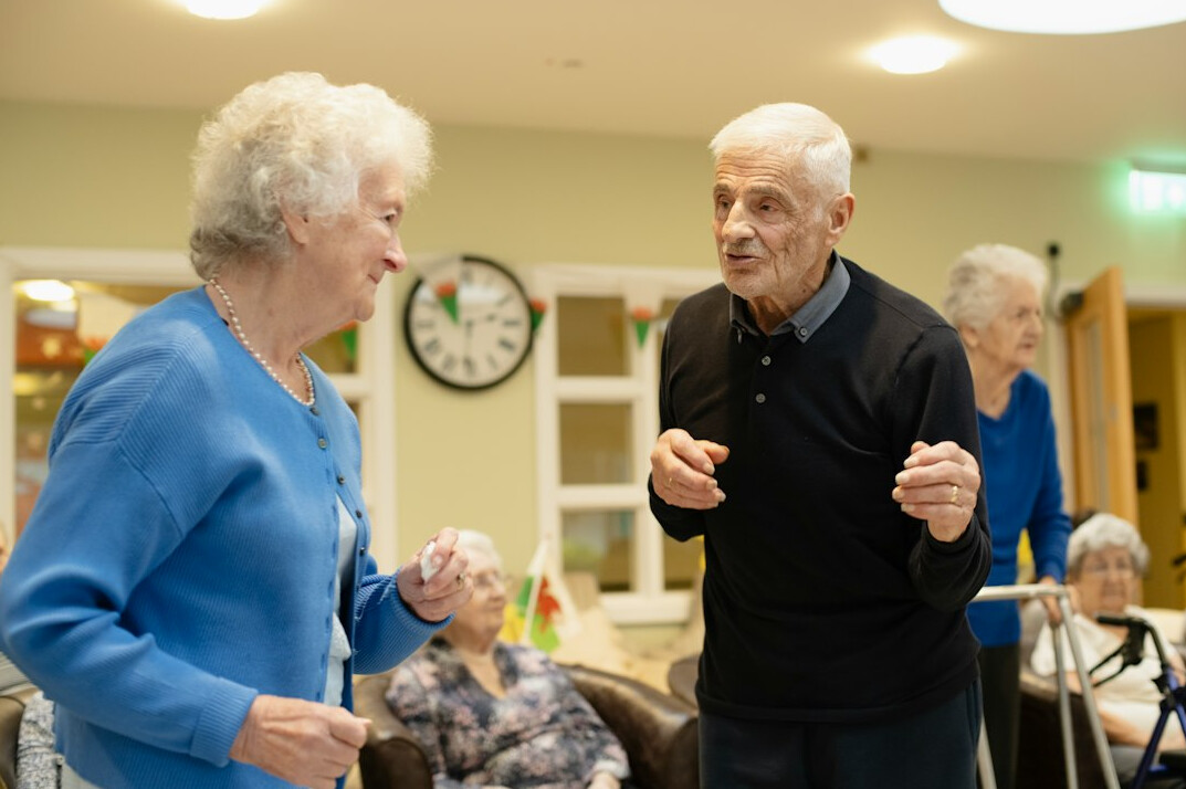 group of seniors doing morning exercise