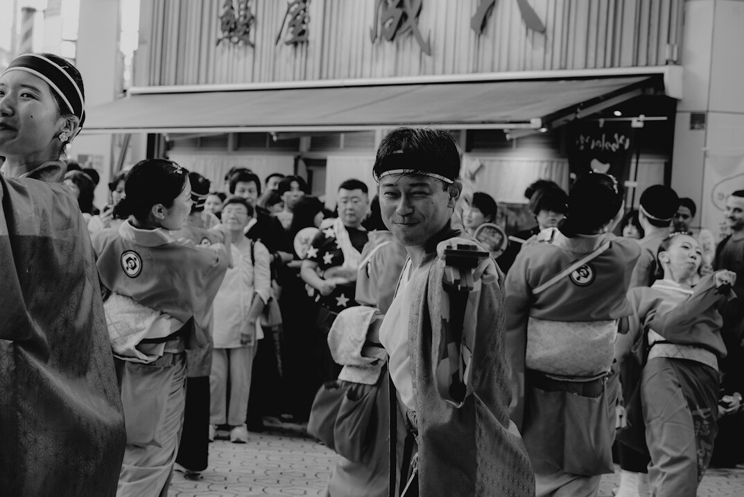 Elderly Japanese couples dancing together at a social dance event