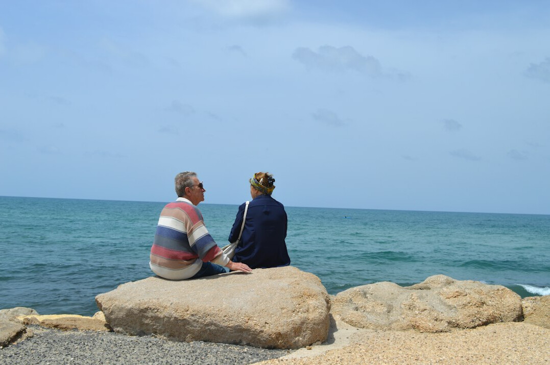 seniors relaxing at beach